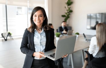 Business woman holding a laptop